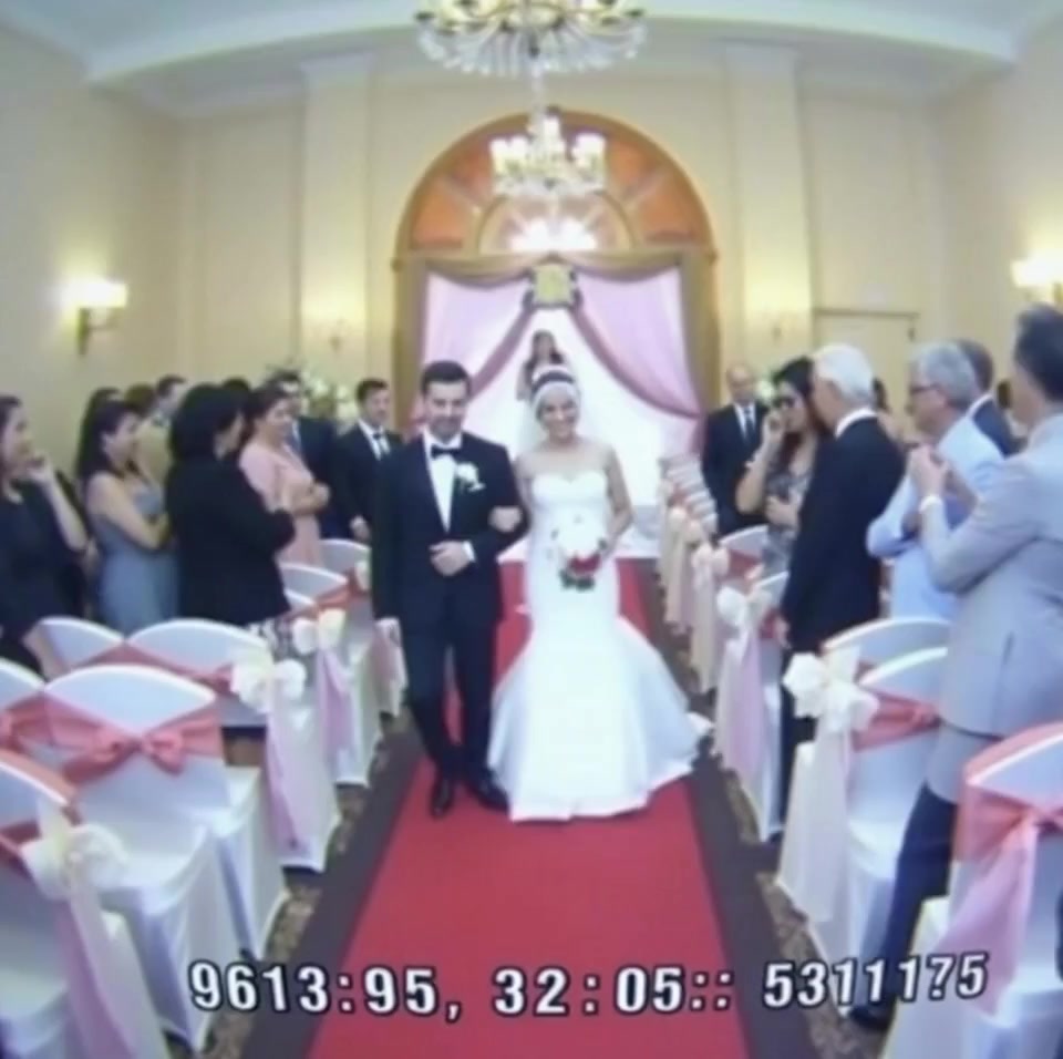 The ceremony was picture-perfect. The bride glowed as she stepped forward, her veil shimmering in